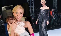 Defilede göz kamaştırdı, kuliste oğlunu uyuttu!